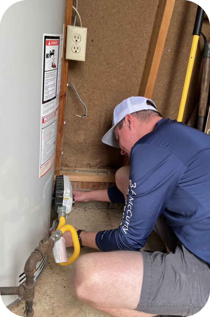 Employee checking an HVAC system