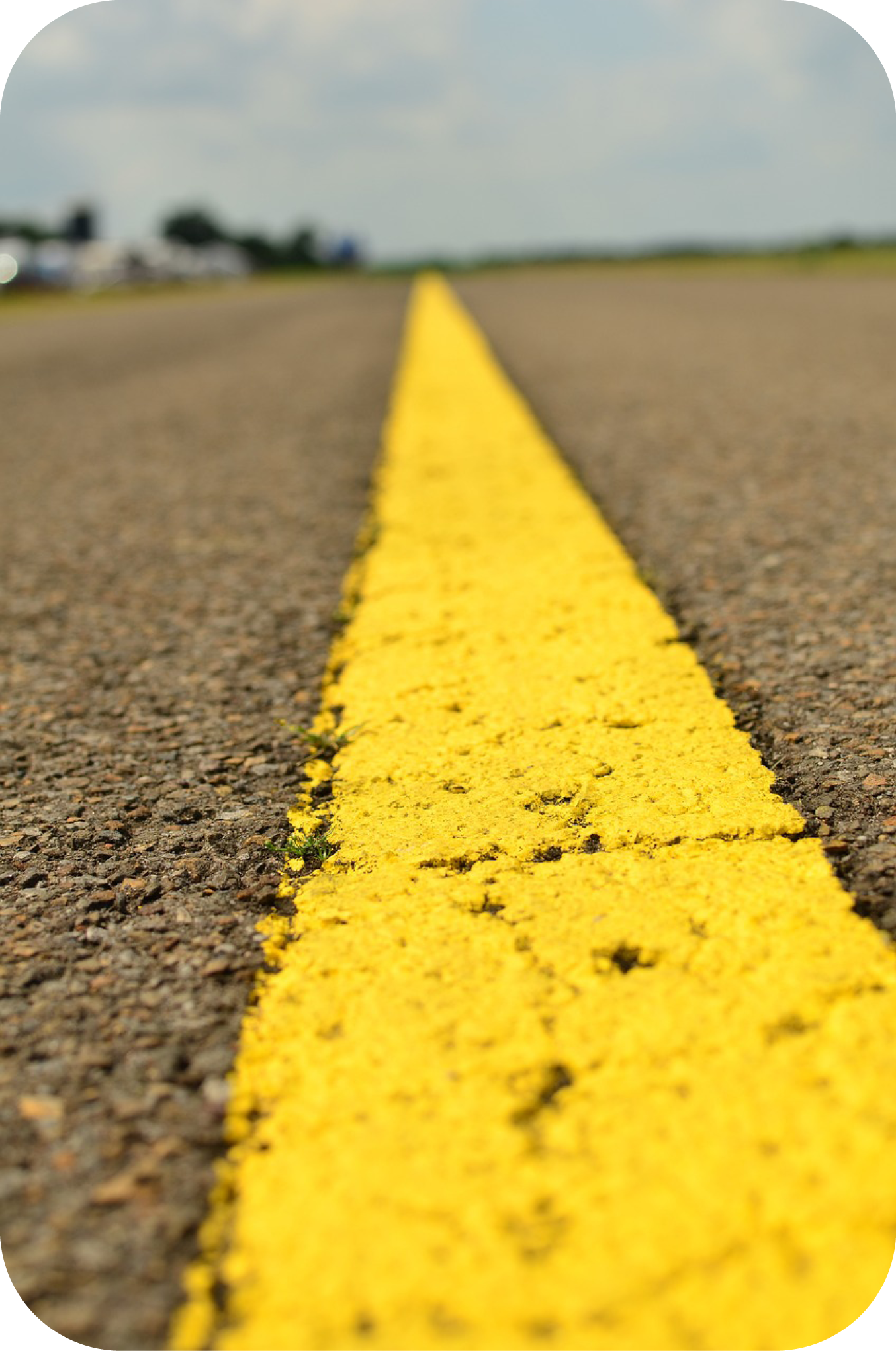 Close up picture of a roadway with cracks